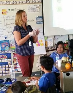 Amy Haessly, Vista Unified nutrition education and training supervisor, going over food labels with a third grade class.