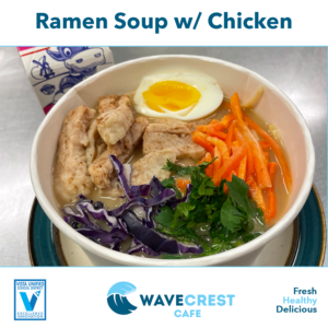 Photo of a bowl of chicken ramen soup with fresh fruits & vegetables