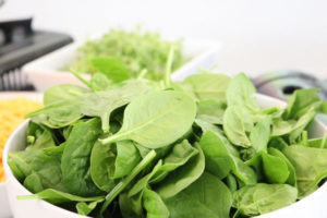 Fresh spinach leaves in a salad bowl