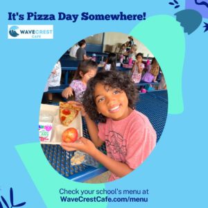 Student smiling while enjoying WaveCrest Pizza at school